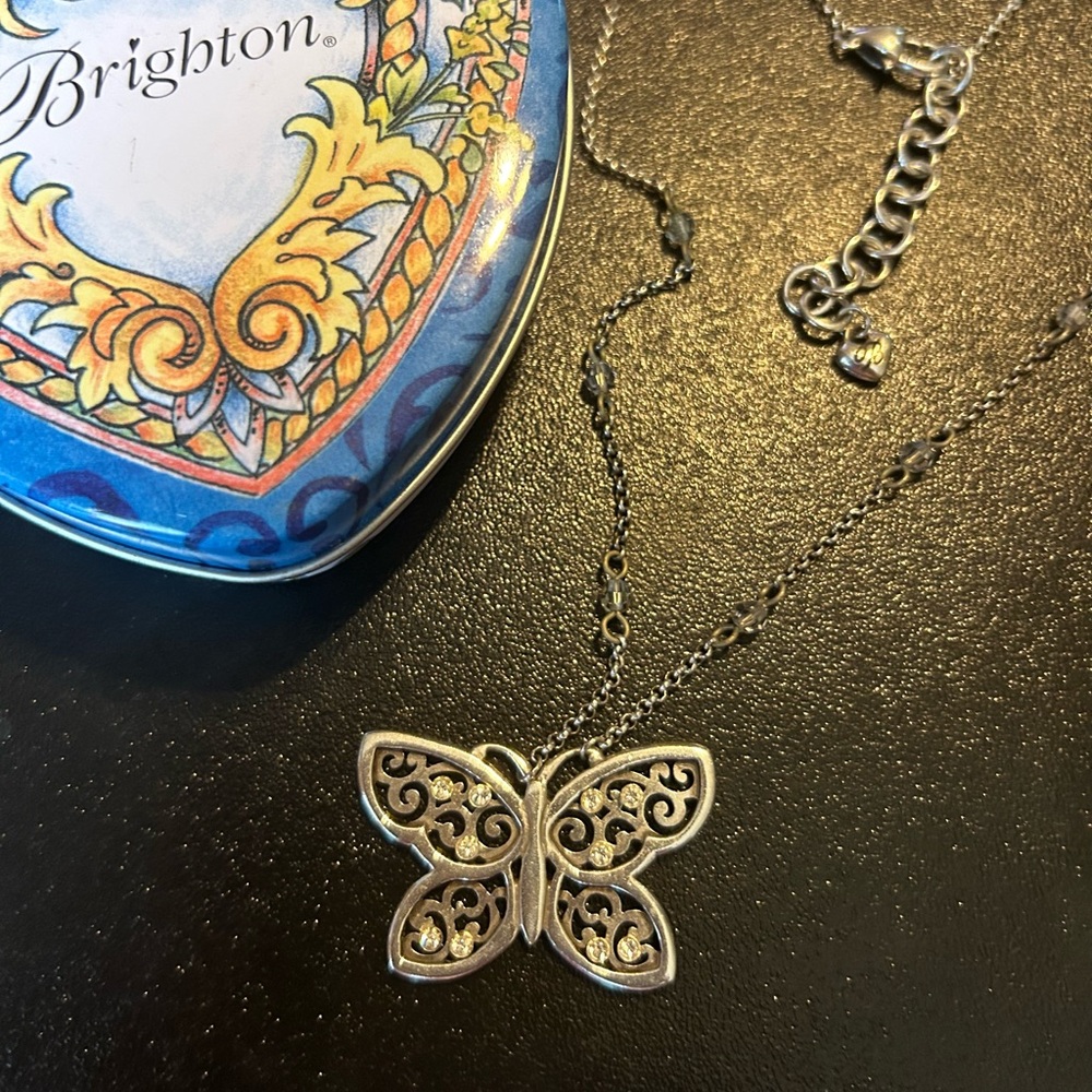 Silver-plated Brighton butterfly necklace. 5 shiny rhinestones on wings